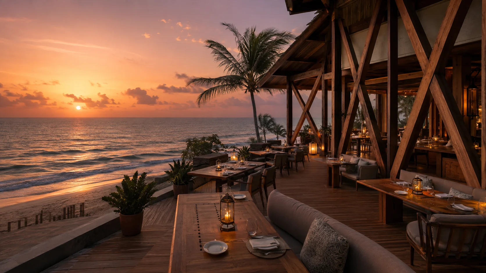 Eatmosphere beachfront dining terrace at golden hour overlooking the Arabian Sea